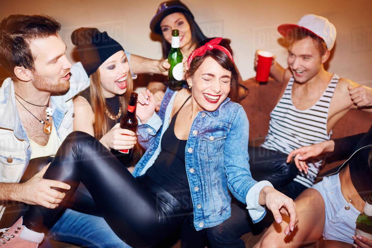 friends laughing despite a minor mishap at a party