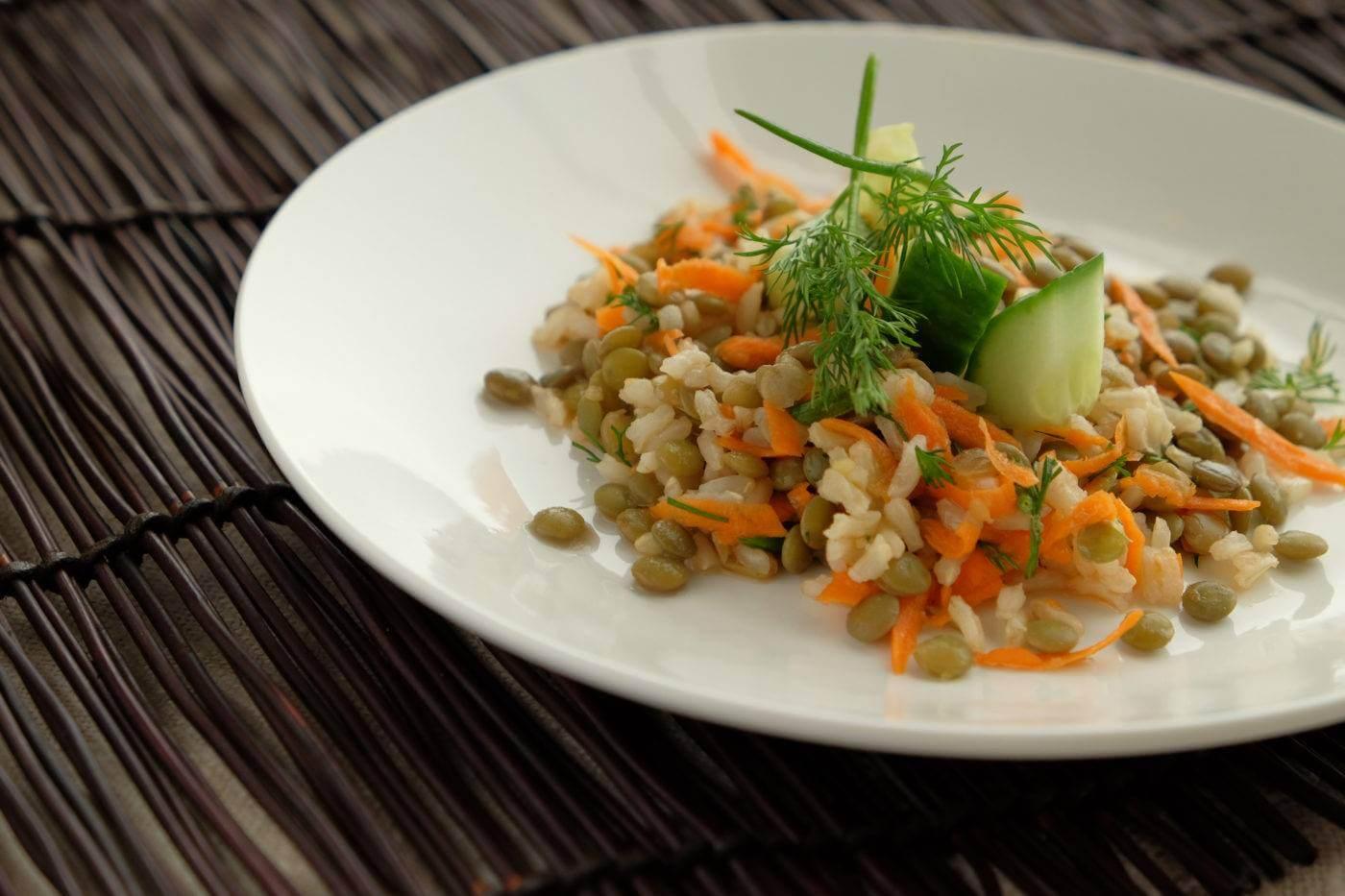 chef presenting a plate of dill and cucumber risotto