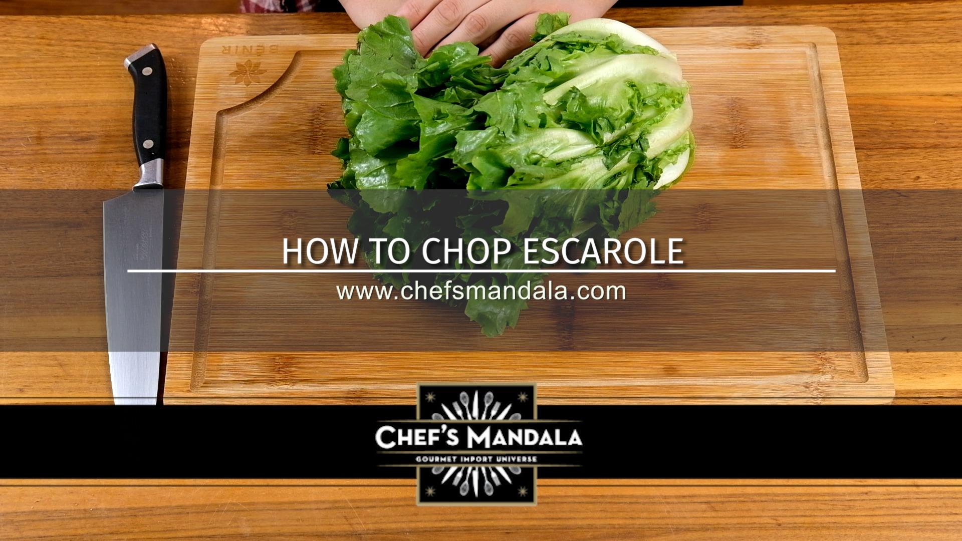 close-up of escarole being chopped on a cutting board