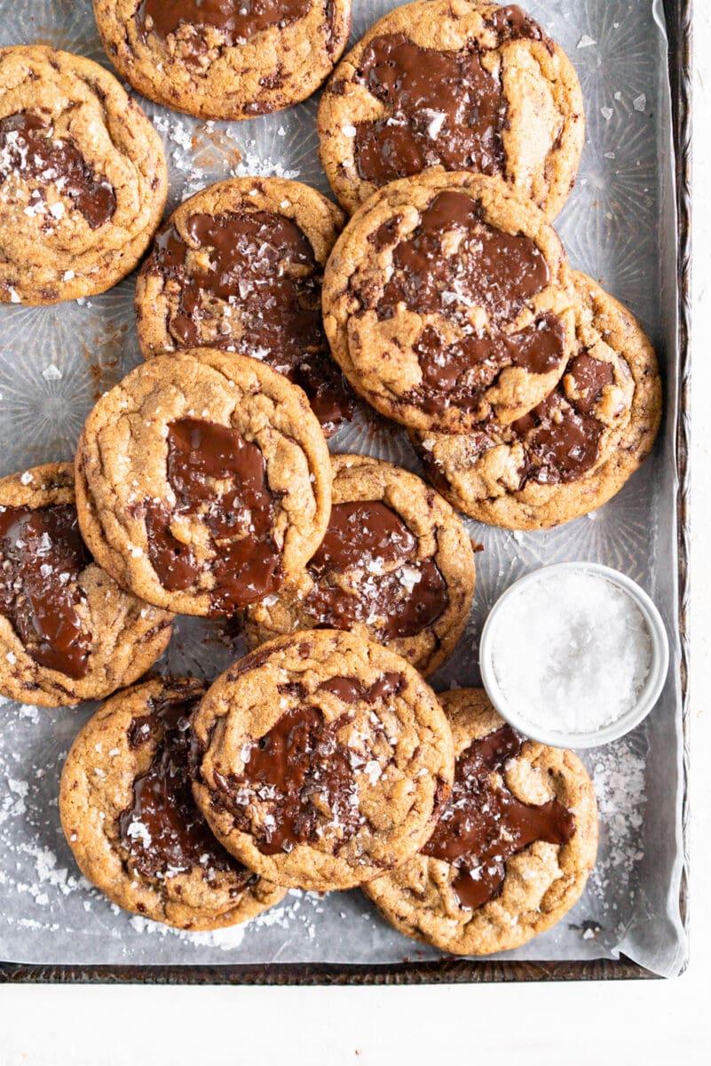Stack of freshly baked soft chocolate chip cookies, close-up with melted chocolate
