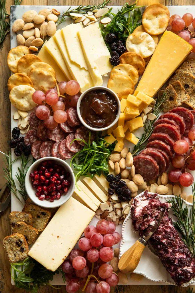 close up of diverse Christmas charcuterie board cheeses