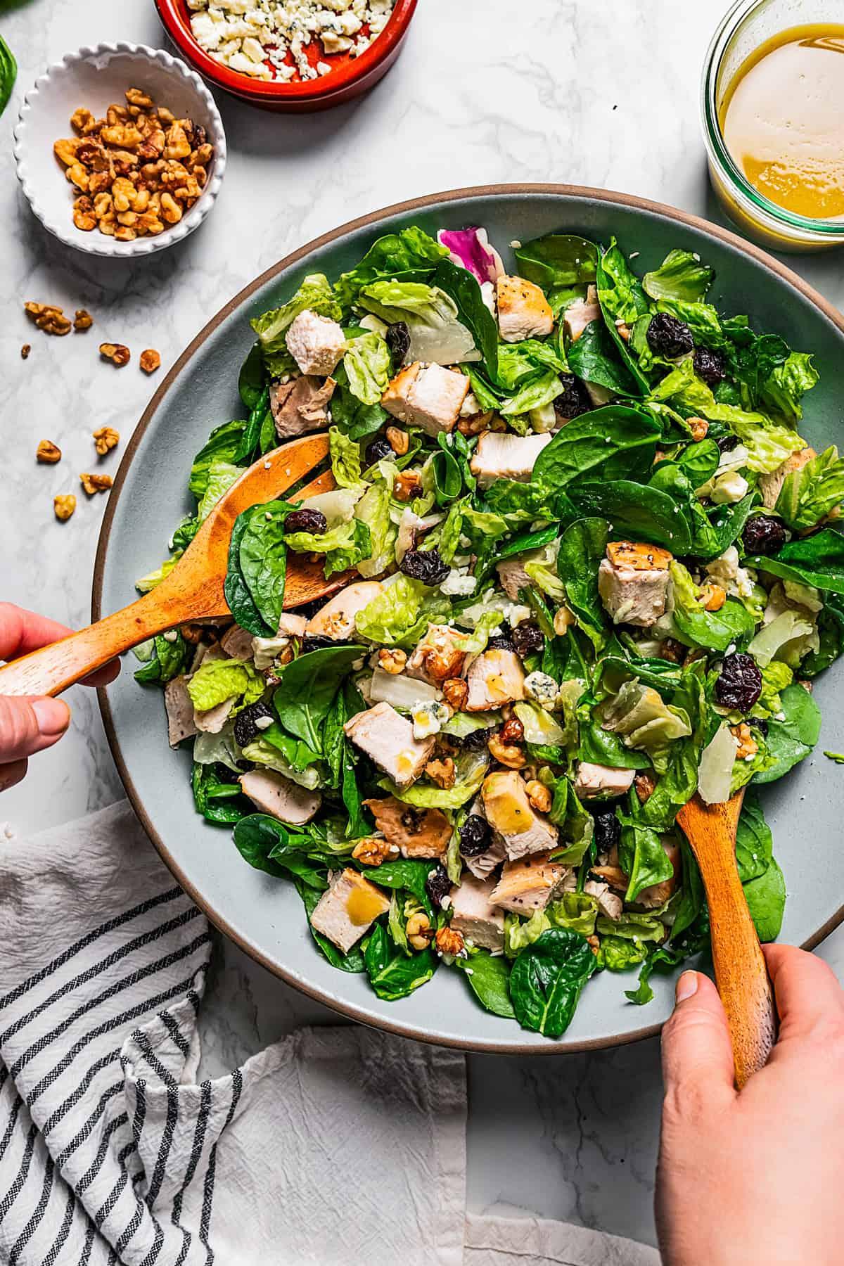 Ingredients for date walnut chicken salad on a wooden table