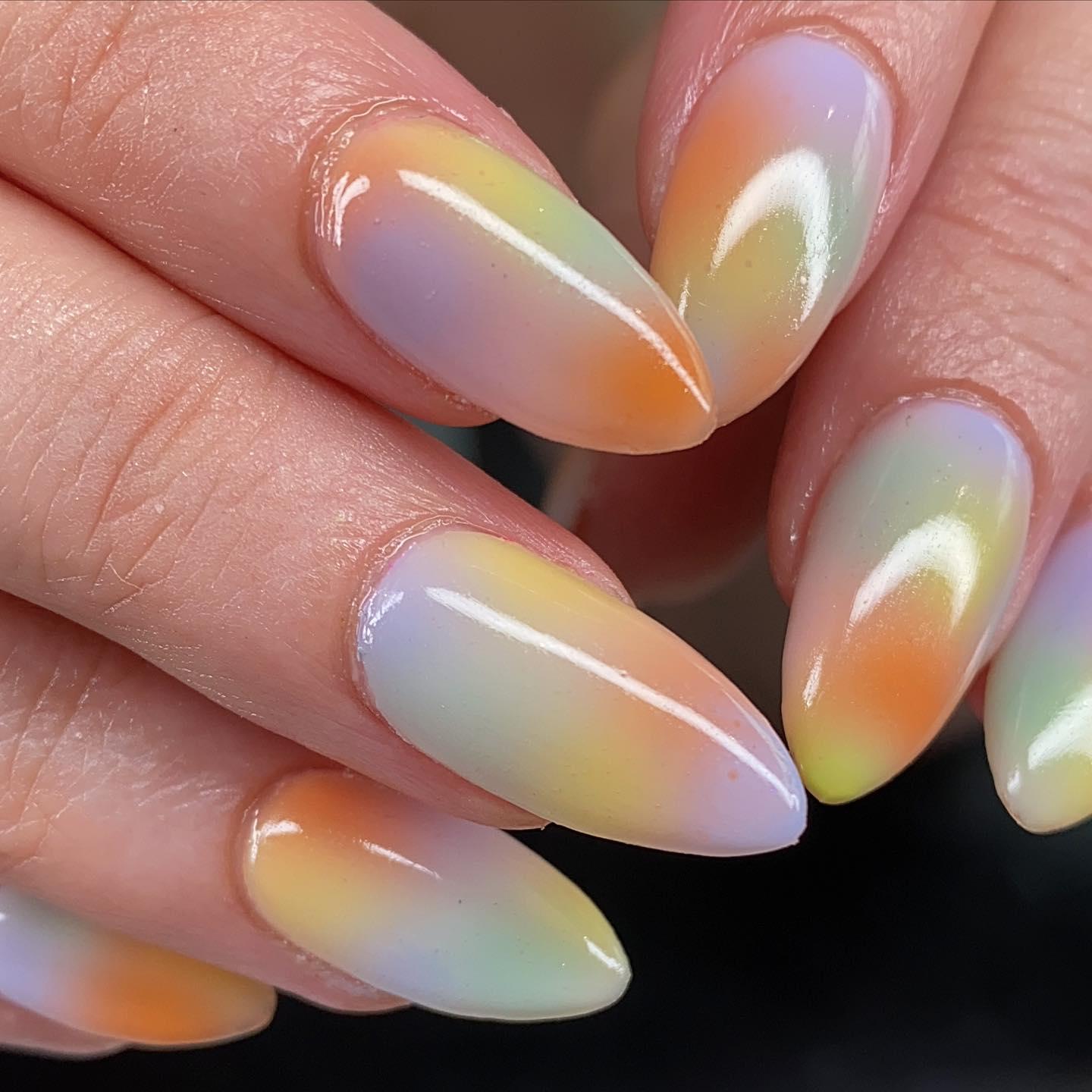 Nail art design showing pastel ombre nails