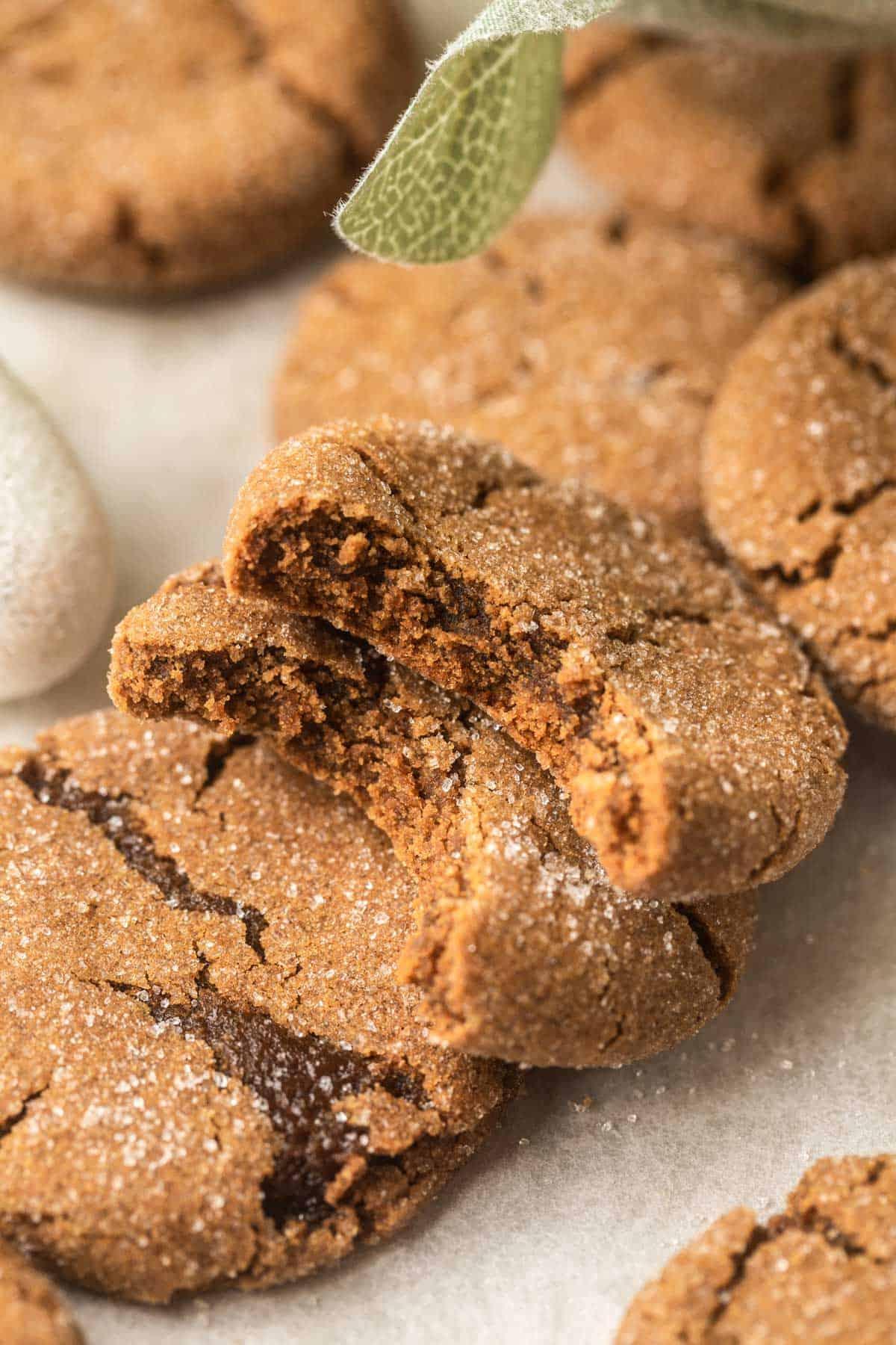 Close-up of a perfectly baked, crinkled molasses cookie, steam rising