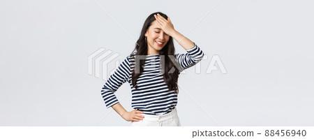 woman laughing at a past fashion mistake