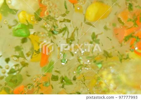 Close-up of fresh vegetables being chopped for soup