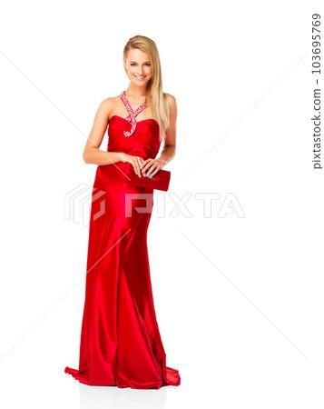 A girl looking happy and confident in a luxurious prom dress
