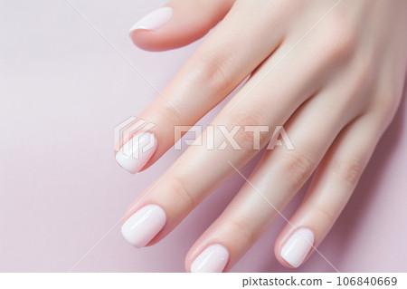 Close-up shot of pastel-colored nails