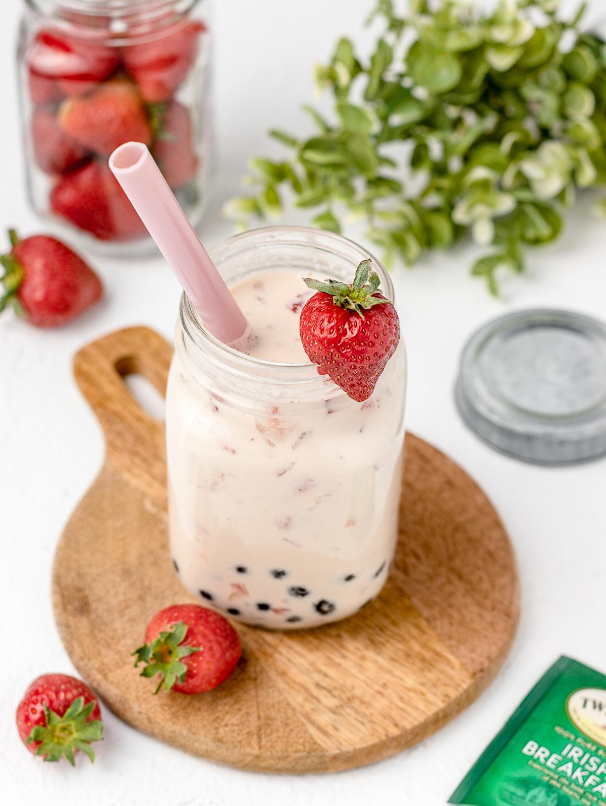 nostalgic scene of a summer afternoon with strawberries and jasmine tea