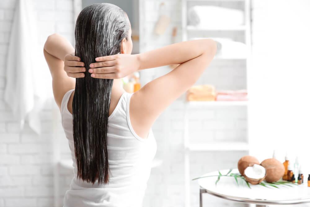 woman applying a hair mask