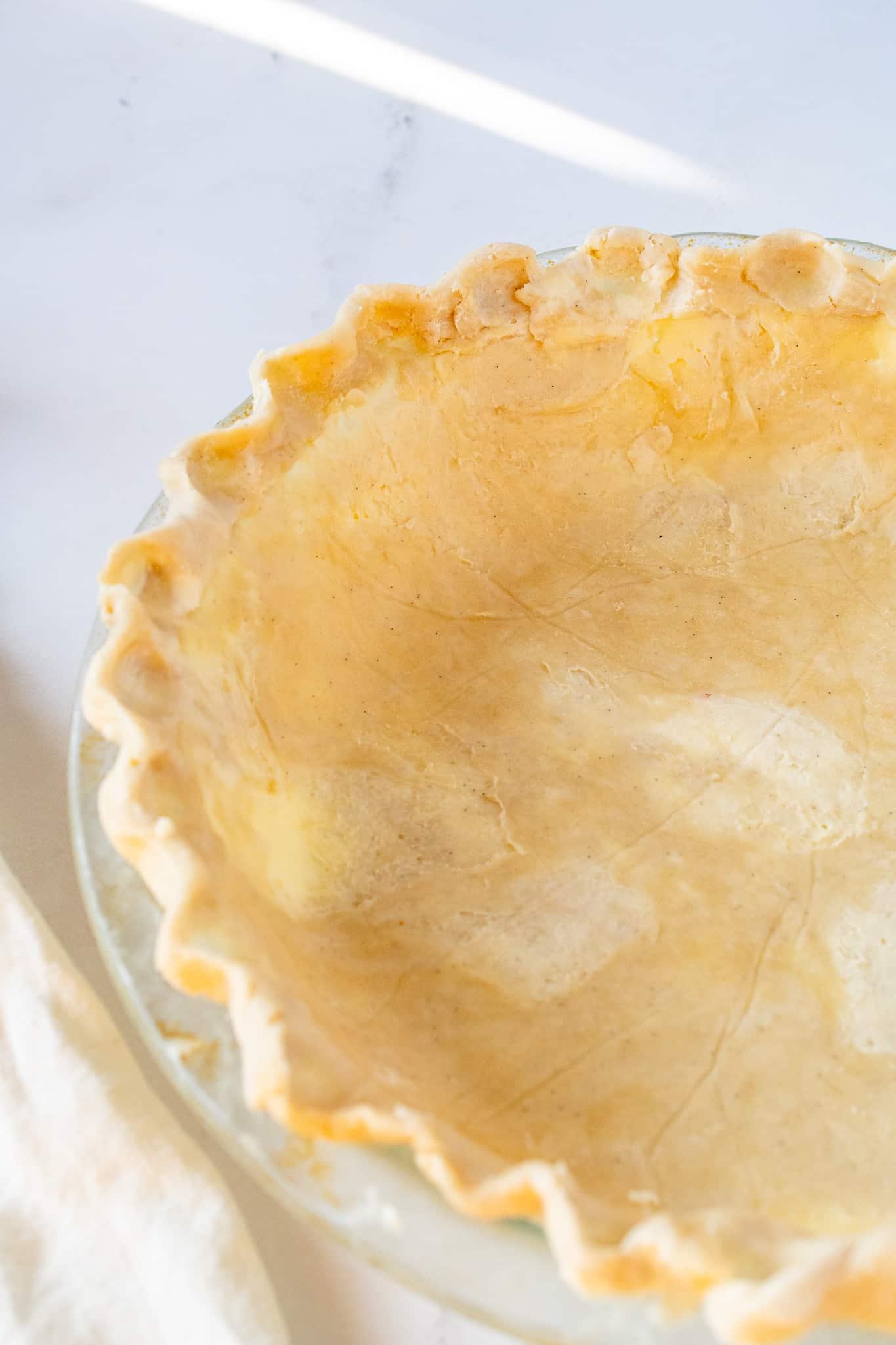 Close-up of golden, flaky pie crust edge