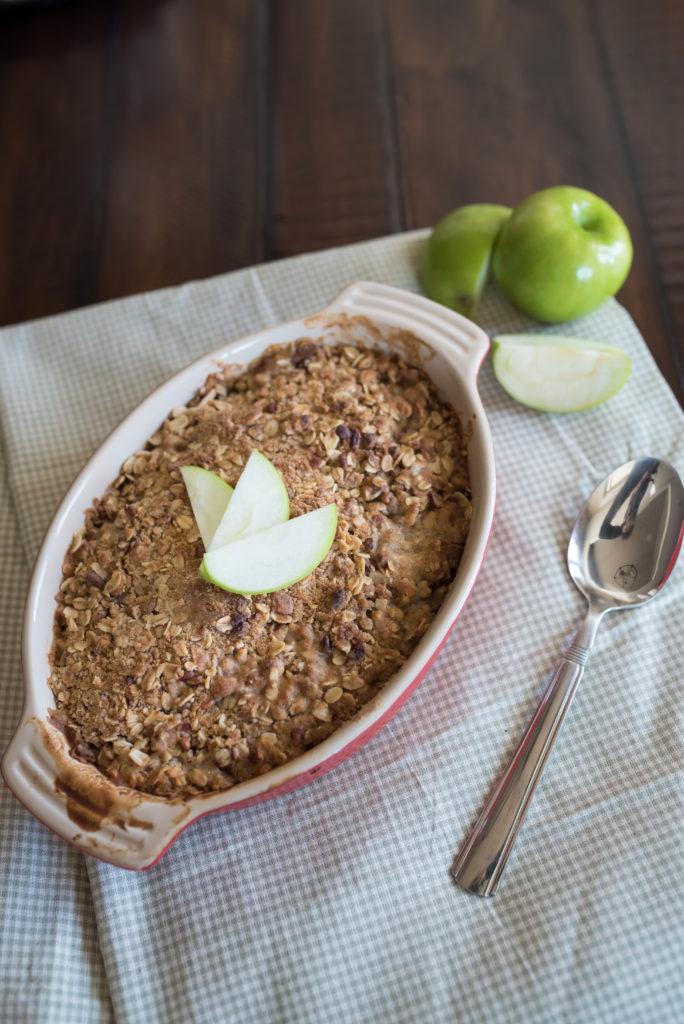 slice of apple crisp being served with a spoon