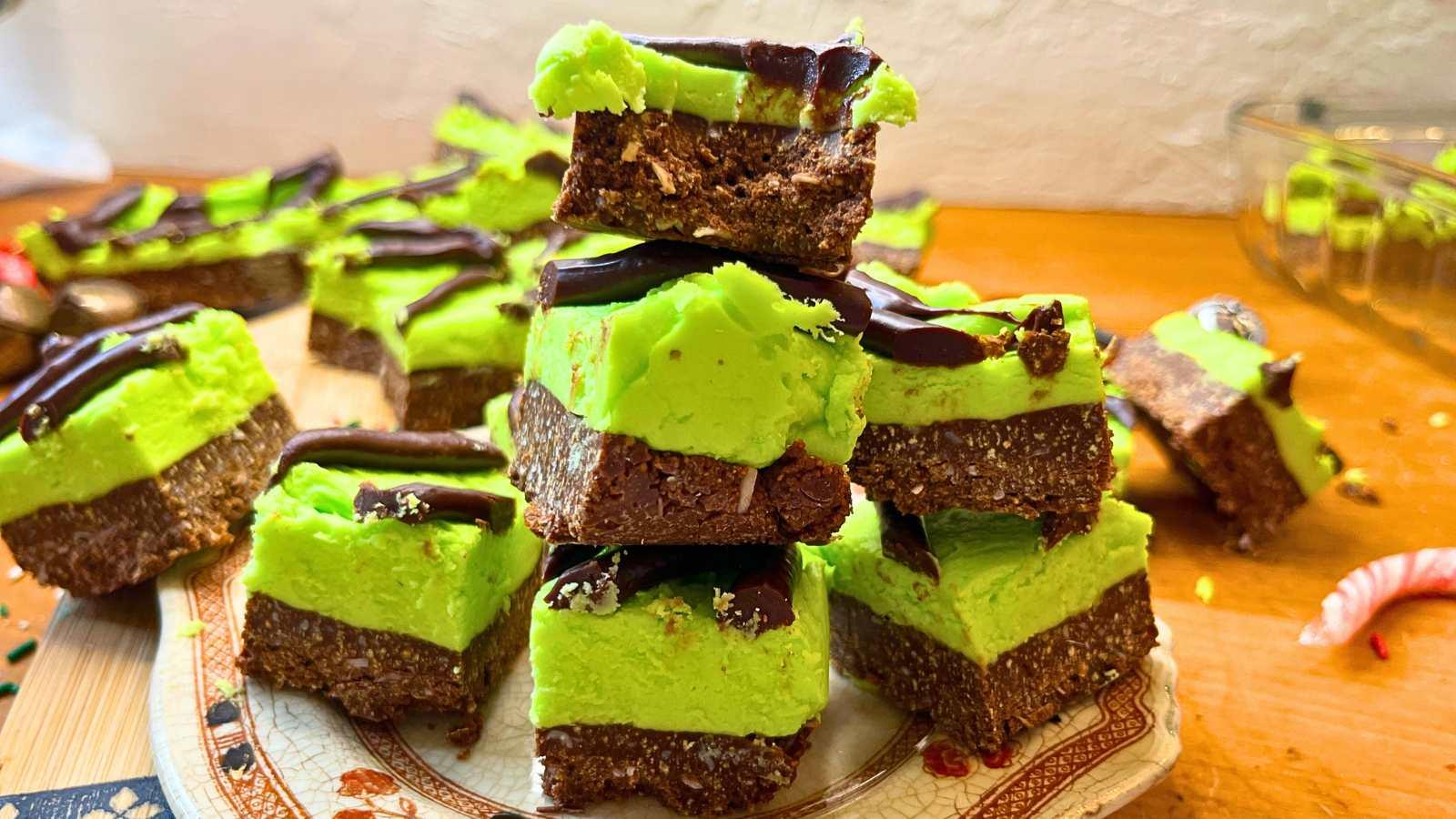 vibrant green and chocolate layered mint chocolate squares, perfectly sliced, on a cooling rack, sunlight, refreshing