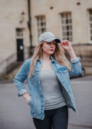 woman wearing double denim baseball outfit