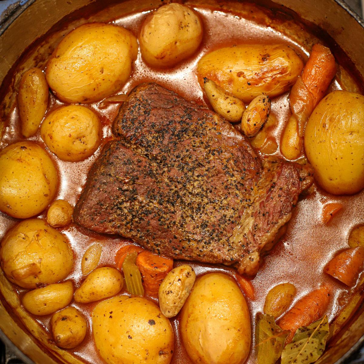 Close-up shot of beef browning in a pot