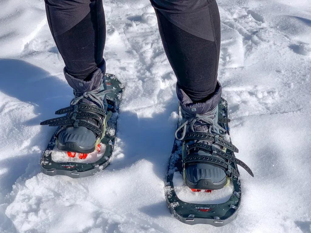 close-up of snowshoe bindings and crampons