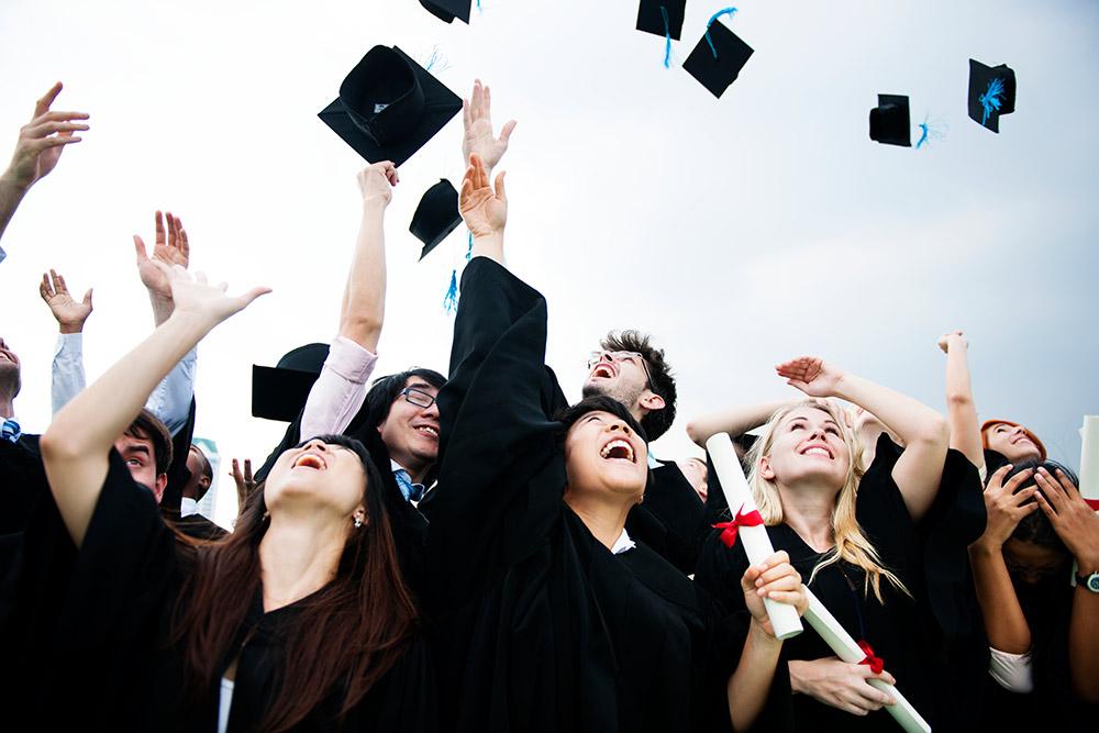students celebrating at graduation