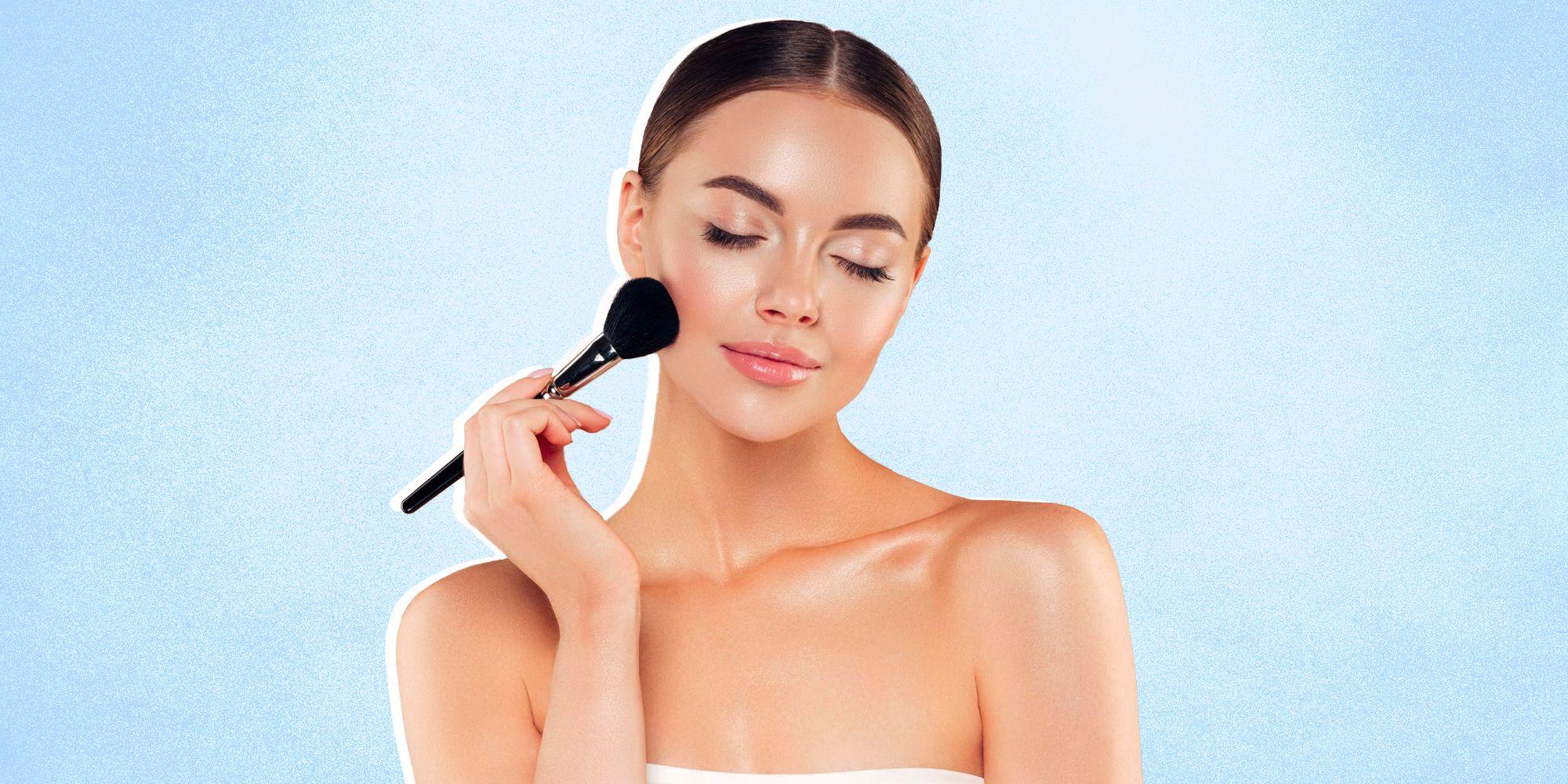 woman applying blush