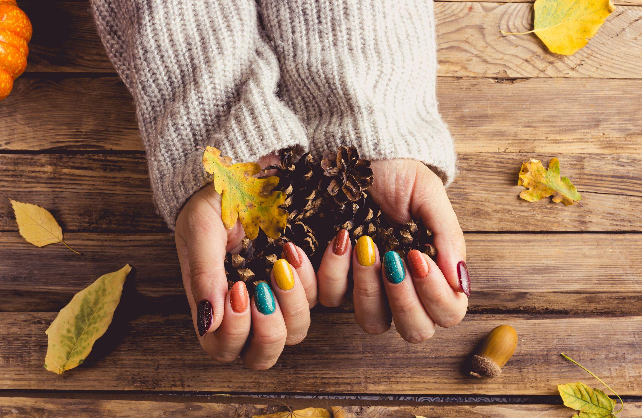 woman showing off her autumn nail art