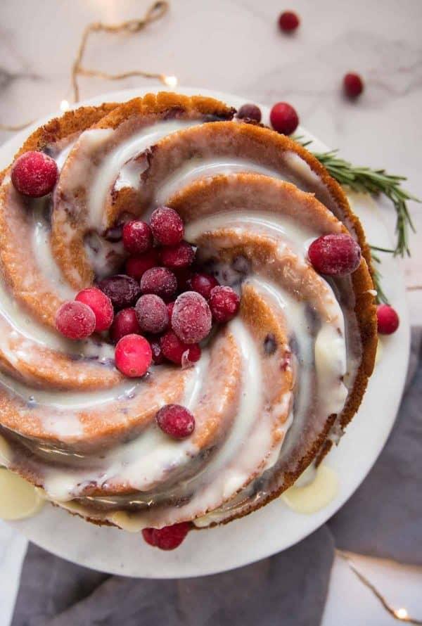 Close-up shot of a sliced Cranberry Rosemary Chocolate Celebration Cake