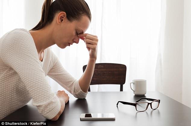 college student looking stressed at phone battery
