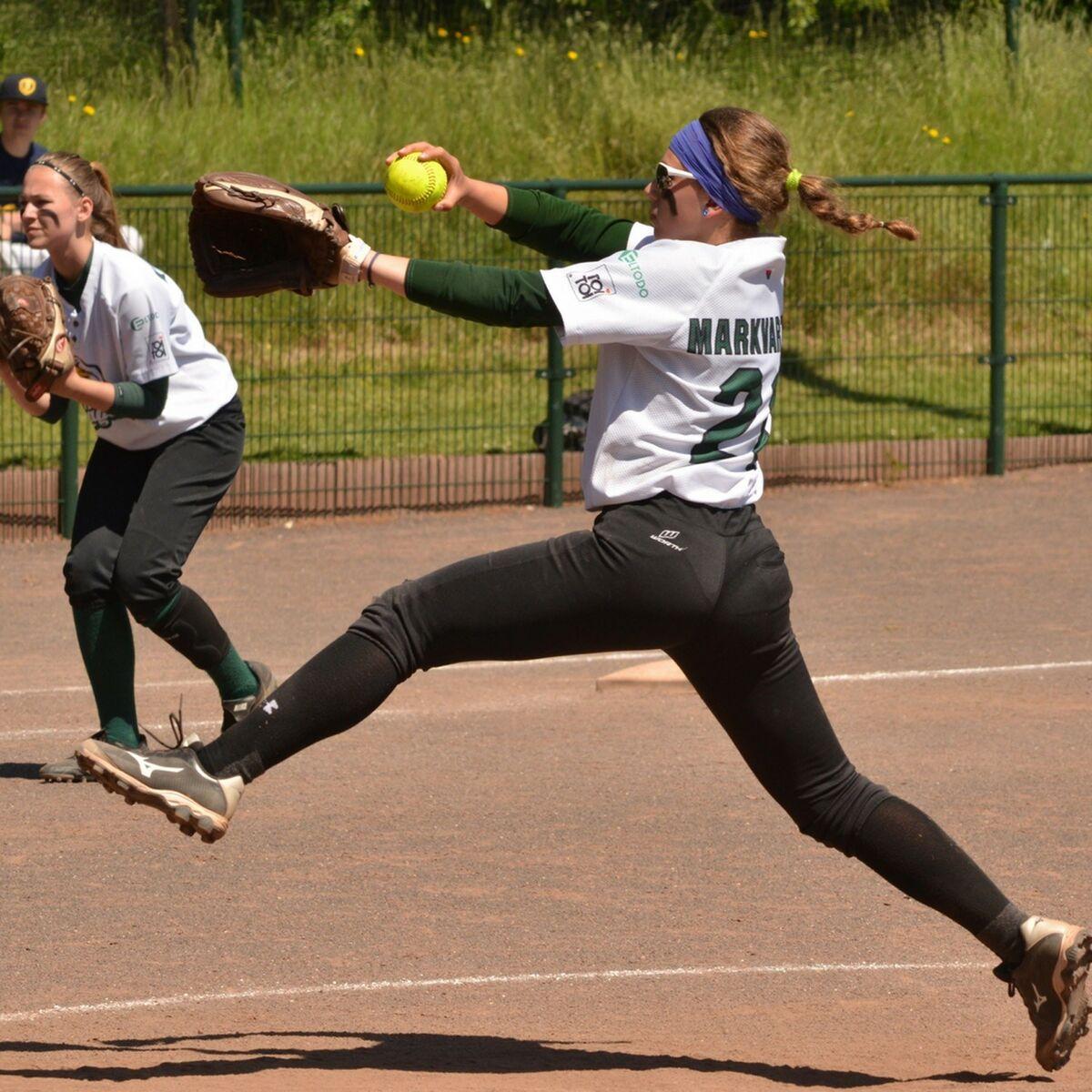 Softball player with headband looking confident