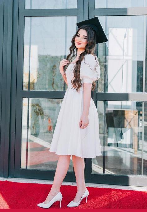 woman smiling in a stylish two-piece graduation dress