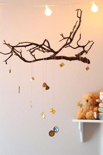 Twig mobile hanging from a ceiling