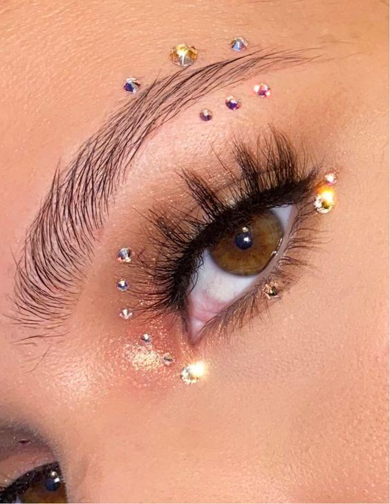 Euphoria inspired makeup look with glitter and gems