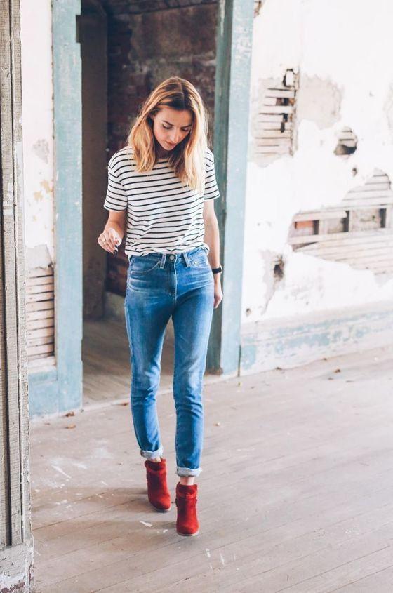 woman wearing bright red ankle boots
