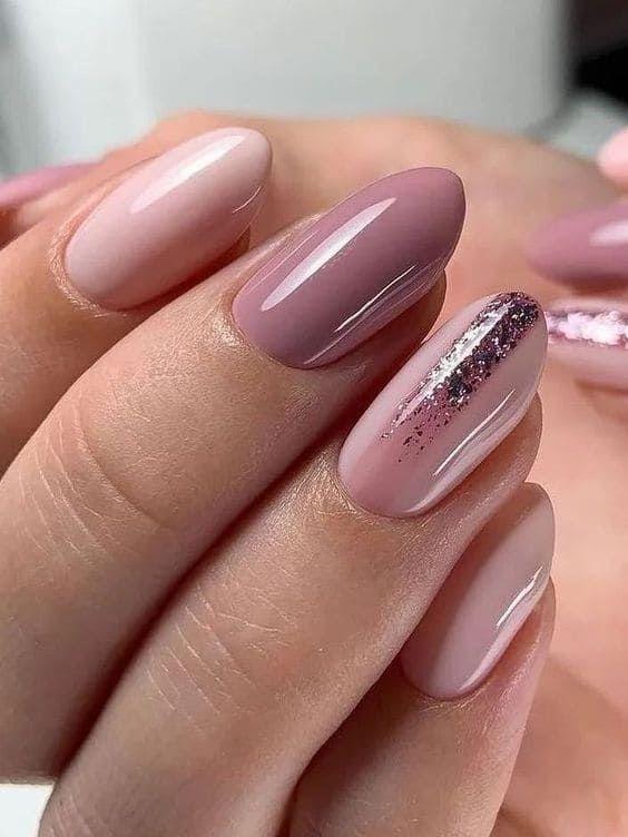 close up shot of soft pink and mauve autumn nail art with subtle shimmer