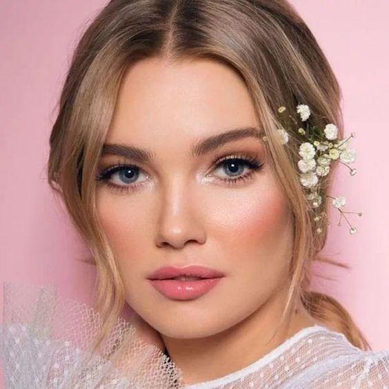 woman with flower crown and soft makeup