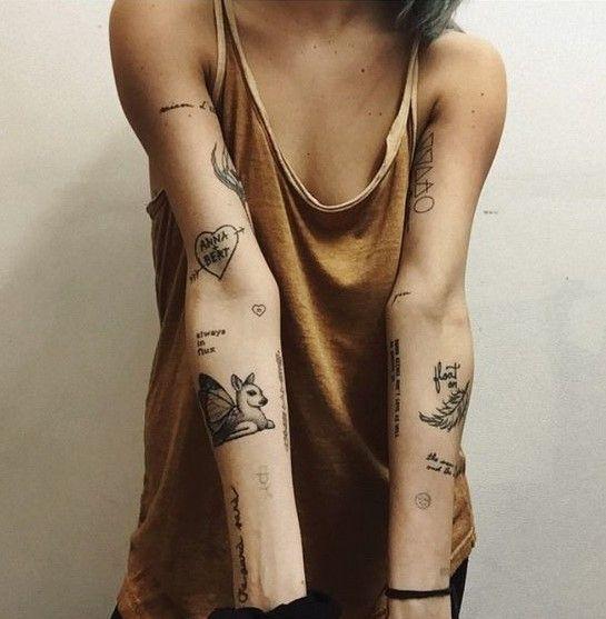 woman with multiple small, vibrant tattoos