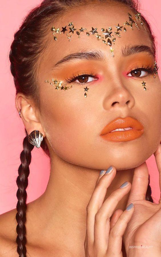 woman with celestial themed face gems at coachella