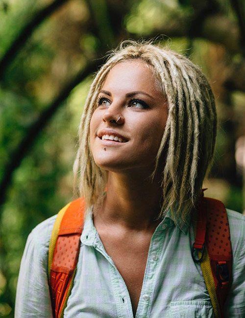 woman with stylish short dreads smiling