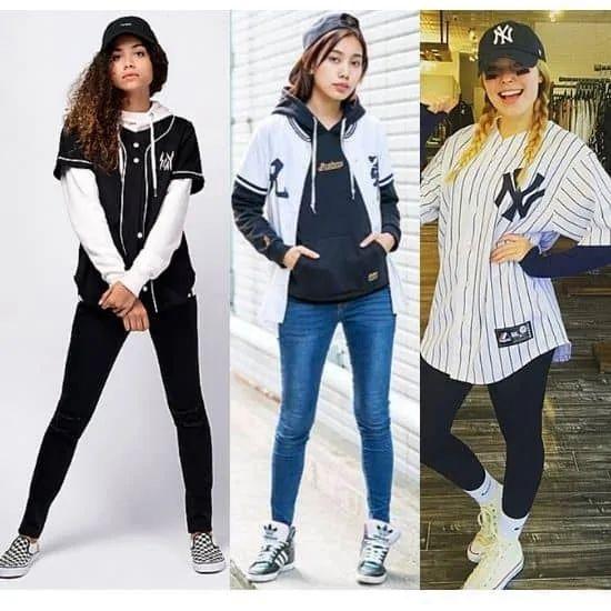 woman in leggings and baseball sweater at a baseball game