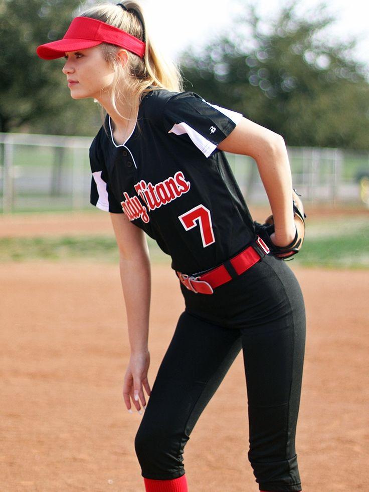 woman wearing a hat and playing softball