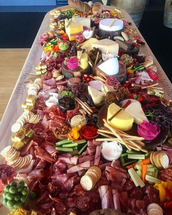 a messy charcuterie board on a table