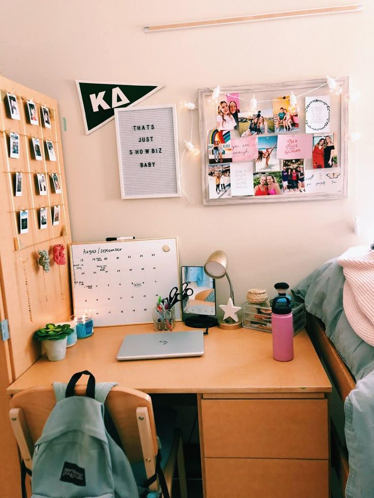 photos displayed on a dorm room desk