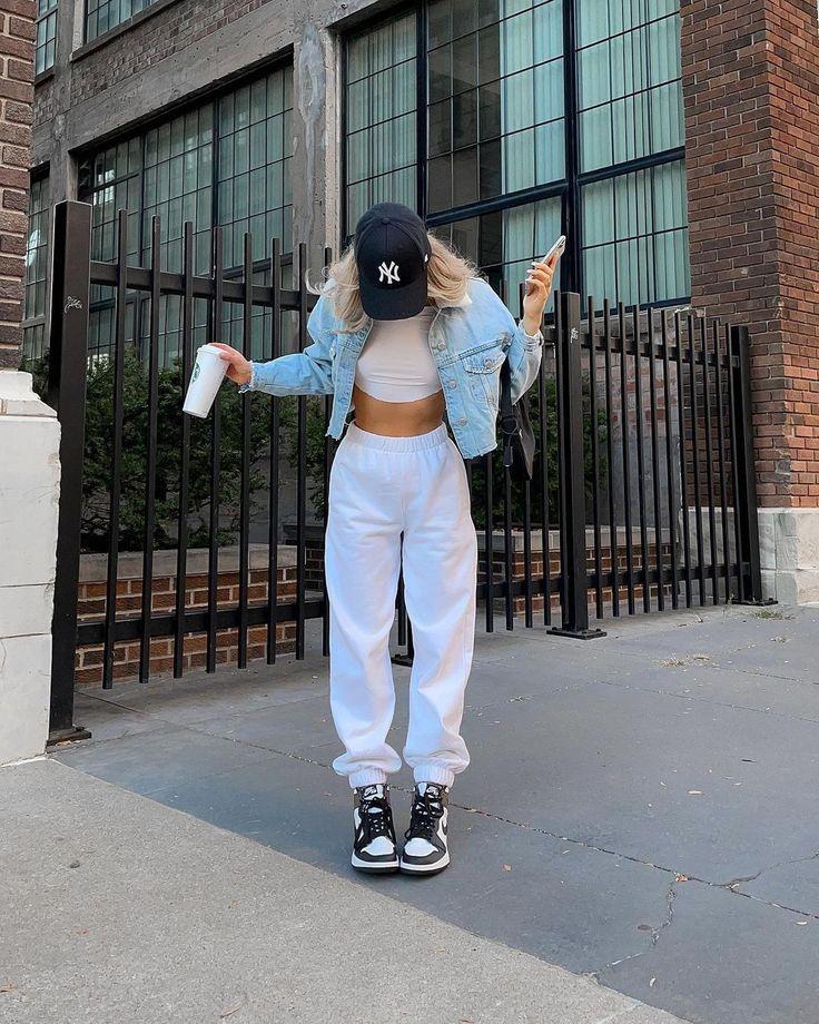 A stylish woman wearing a simple but stylish streetwear outfit