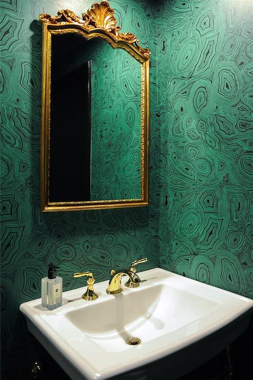 emerald green powder room with gold accents