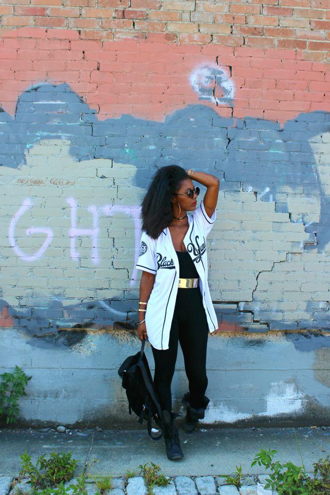 woman layering baseball-themed clothing