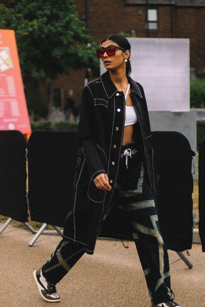 stylish woman in urban setting wearing streetwear