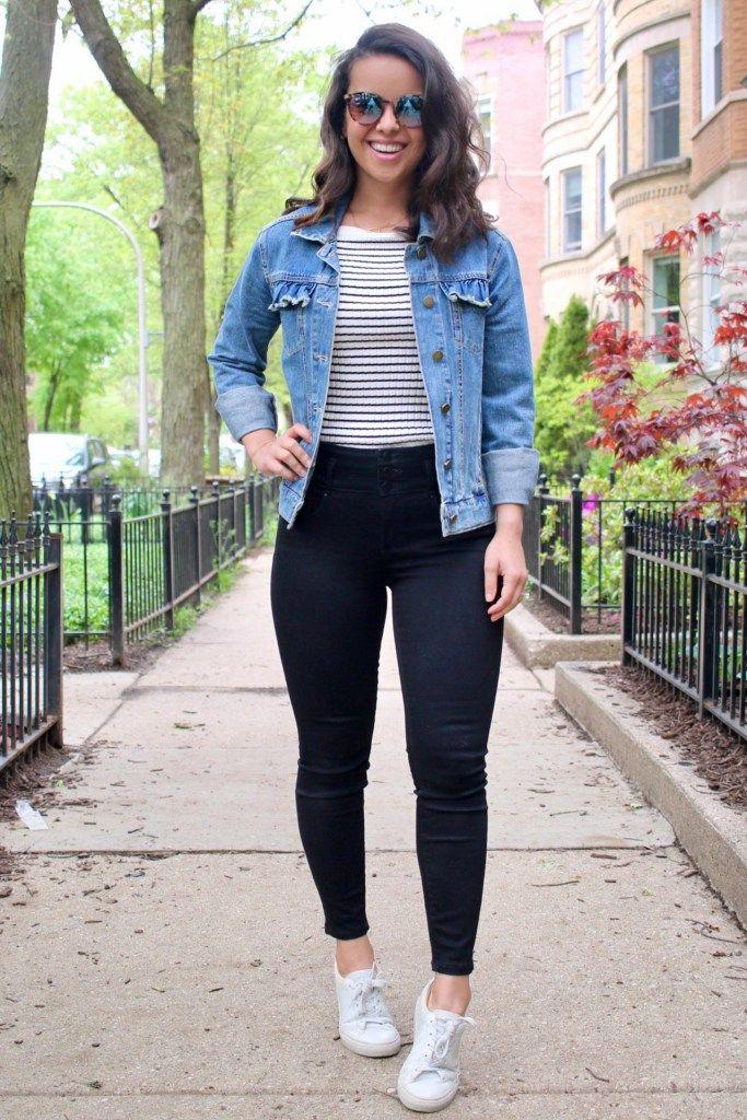 Woman wearing a denim jacket and jeans