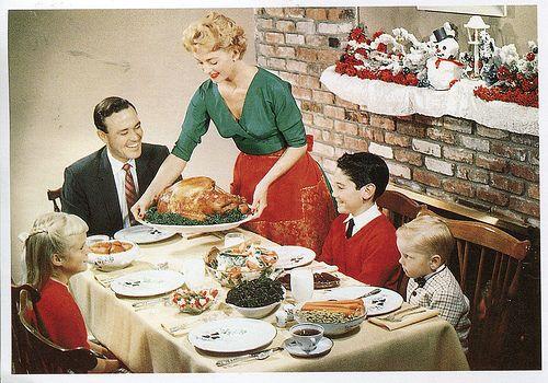 vintage photo of a family Christmas dinner table with food
