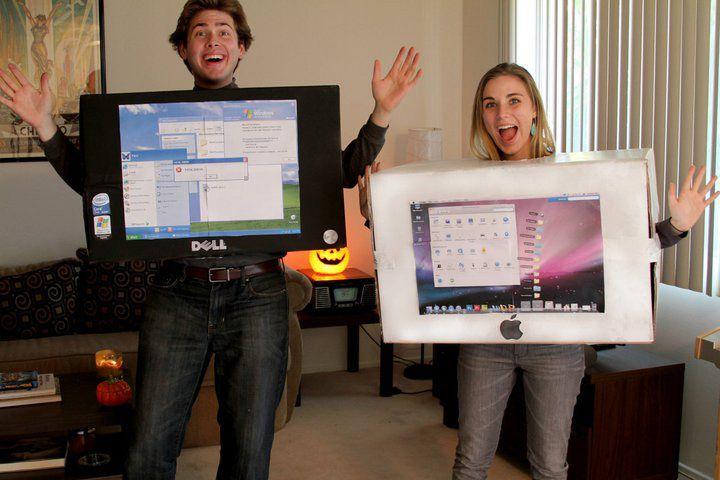 two friends brainstorming halloween costumes on a laptop