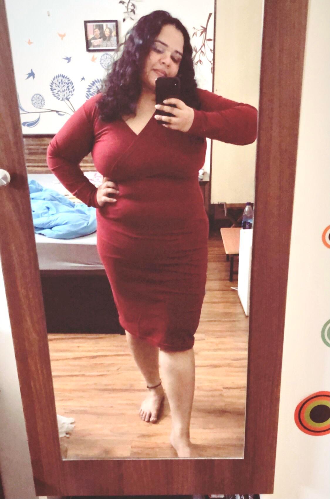 woman confidently wearing a bodycon dress