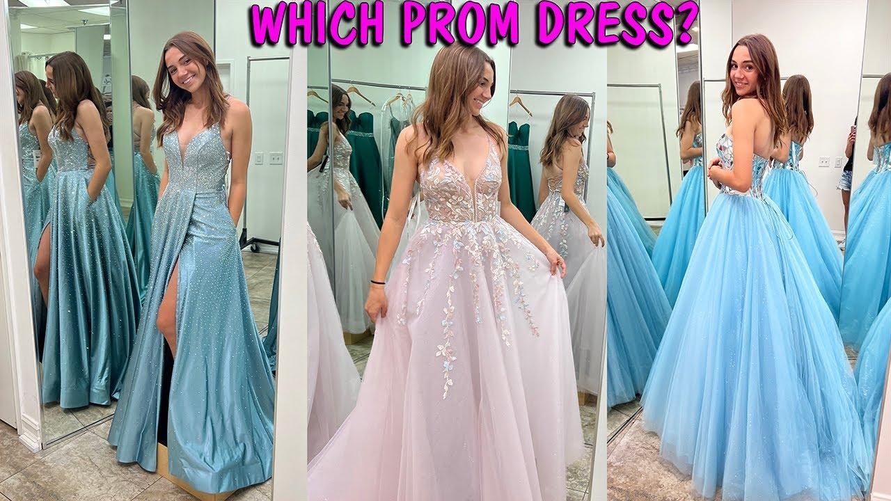 teenager joyfully picking out prom dress