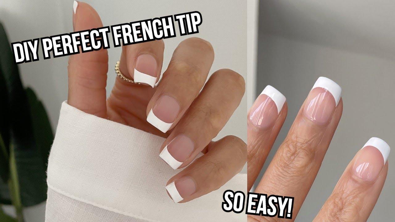 woman with perfect french manicure at home