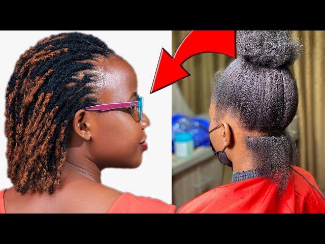 woman taking care of her short dreadlocks